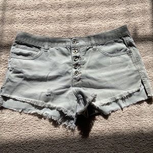 Free People distressed greenish neutral denim shorts. Size 29.